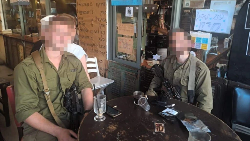 D. and L., members of an elite IDF unit that fought in the battle of Kibbutz Be'eri, sharing their story in Jerusalem on Oct. 23, 2023. Photo by Gil Tannenbaum/TPS.