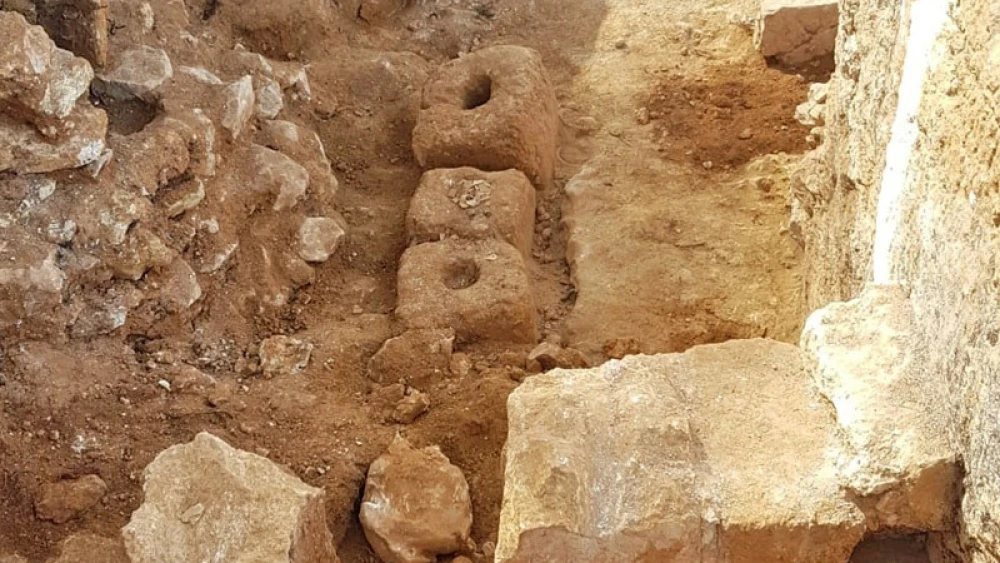 An ancient olive press uncovered at a 2,000-year-old Hasmonean village in Jerusalem. Photo by Ya’akov Billig/Israel Antiquities Authority.