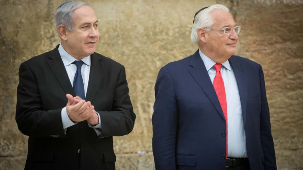 Israeli Prime Minister Benjamin Netanyahu and U.S. Ambassador to Israel David Friedman at the Western Wall in the Old City of Jerusalem on the first night of Hanukkah, on Dec. 22, 2019. Photo by Noam Revkin Fenton/Flash90.