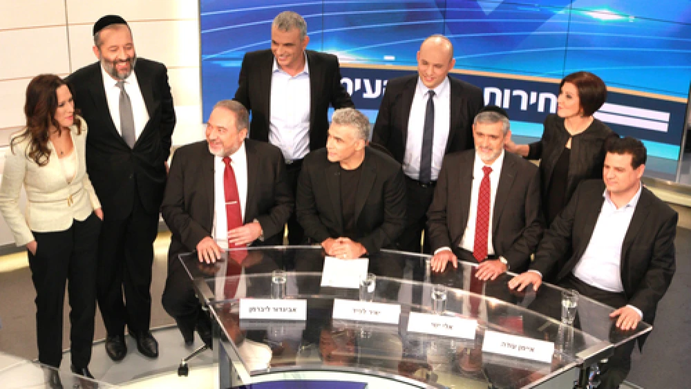 Pictured at the Feb. 26 Israeli election debate hosted by Israel's Channel 2 network: Yisrael Beiteinu Party leader Avigdor Lieberman (bottom left); Yesh Atid Party leader Yair Lapid (bottom, second from left); Yachad Party leader Eli Yishai (bottom, second from right); Joint Arab List Party leader Ayman Odeh (bottom right); Meretz Party leader Zehava Gal-On (top right); Shas Party leader Aryeh Deri (top, second from left); Habayit Hayehudi Party leader Naftali Bennett (top, second from right); Kulanu Party leader Moshe Kahlon (top, center); and Channel 2 news anchor Yonit Levi (top left). Credit: Channel 2 News.