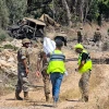 Lebanese army soldiers inspect the site of an explosion that targeted their vehicle in the Southern Lebanese area of al Mansouri near Tyre on July 18, 2026. Photo by Kawnat Haju / AFP via Getty Images.