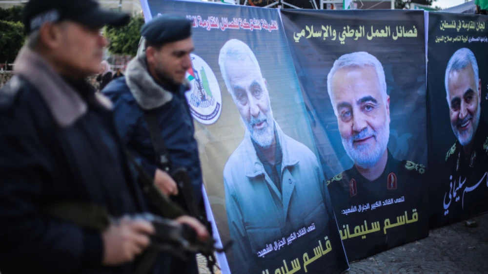 Palestinians in Gaza City walk next to posters of Qassem Soleimani, who was killed in a U.S. drone strike in Iraq a day earlier. Jan. 4, 2020. Photo by Hassan Jedi/Flash90.