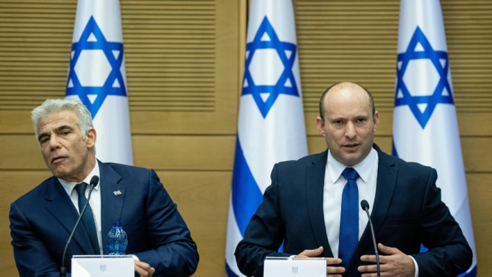 Israeli Prime Minister Naftali Bennett and Foreign Minister Yair Lapid at the Knesset, on June 13, 2021. Photo by Yonatan Sindel/Flash90.