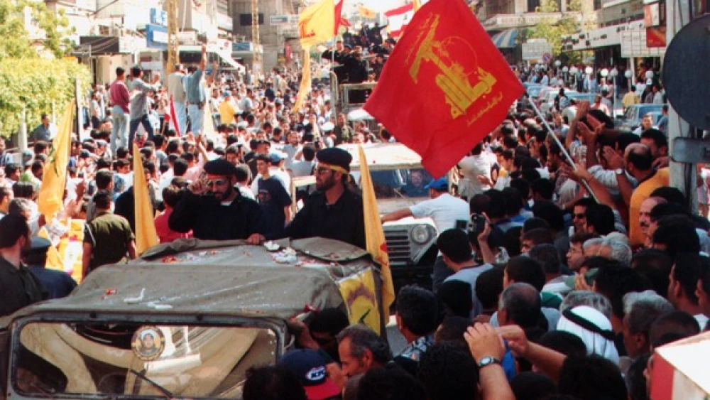 Hezbollah militants and supporters at a parade following the end of Israel's occupation of southern Lebanon in May 2000. Credit: Khamenei.ir via Wikimedia Commons.
