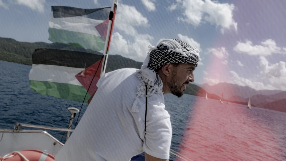 A participant in the Turkish-led attempt to break the naval blockade of the Gaza Strip, on a ship near a Turkish port, May 14, 2026. Photo by Murat Kocabas/Middle East Images/AFP via Getty Images.