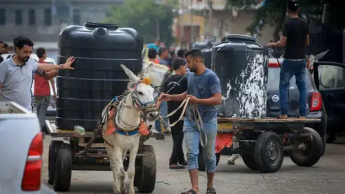 Palestinian civilians wait to collect water in Rafah in the southern Gaza Strip, Oct. 28, 2023. Photo by Abed Rahim Khatib/Flash90.
