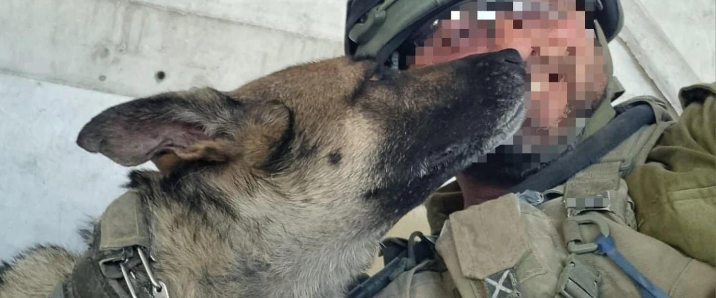 Officer "O" on duty in Gaza with a dog, Sept. 2025. Credit: Israel Police.
