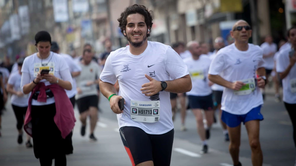 Runners take part in a marathon in Israel's coastal city of Tel Aviv on Feb. 28, 2020. Photo by Miriam Alsterýþ/Flash90.