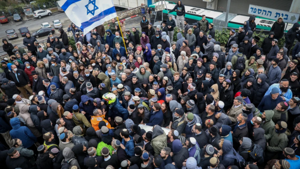 Family and friends attend the funeral of 25-year-old yeshivah student Yehuda Dimentman, who was shot and killed in a Palestinian terror attack near Homesh, at Har HaMenuchot cemetery in Jerusalem on Dec. 17, 2021. Photo by Noam Revkin Fenton/Flash90