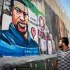 Palestinians walk past a mural of George Floyd painted on a section of the security barrier in the city of Bethlehem, June 8, 2020. Photo by Wisam Hashlamoun/Flash90.
