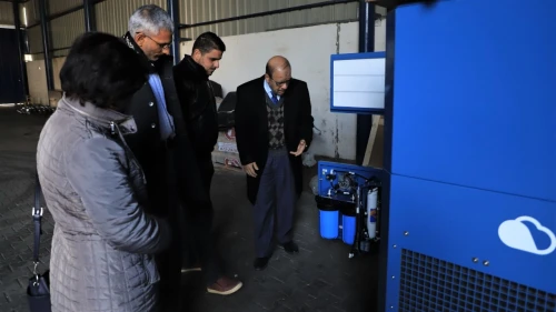Examining the GEN-M water machine in the Gazan neighborhood of Abasan al-Kabira, Feb. 12, 2020. Credit: Damour for Community Development.