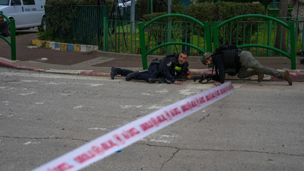Security and rescue forces at the scene where a missile fired from Lebanon caused damage in the northern Israeli city of Kiryat Shmona, March 23, 2026. Photo by Ayal Margolin/Flash90.