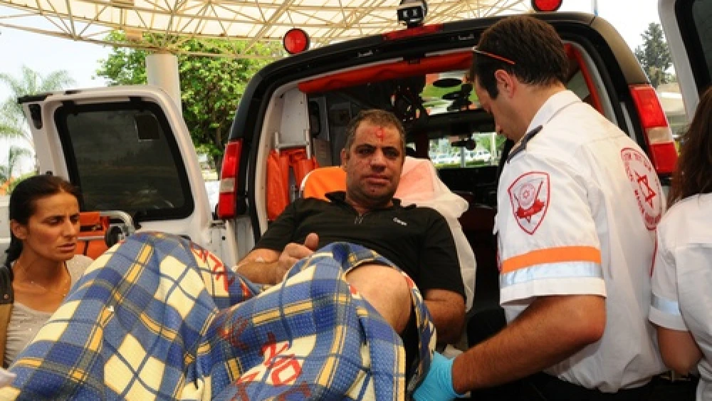 Israeli emergency response professionals tend to a man wounded the previous day in the terrorist bombing in Burgas, Bulgaria, July 19, 2012. Photo by Yossi Zeliger/Flash90.