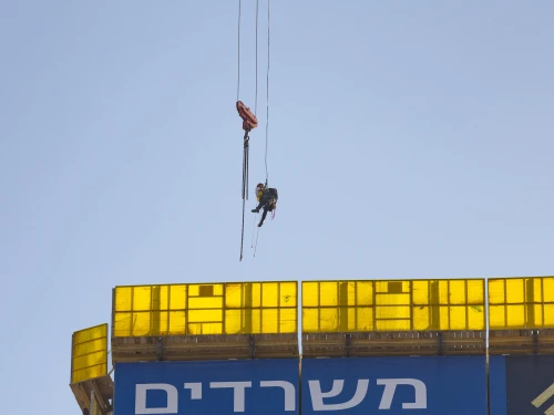 A general view of a crane on which a teenage boy climbed, at the entrance to Jerusalem, Nov. 24, 2025. Photo by Chaim Goldberg/Flash90.