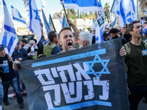 An Israel Defense Forces reservist from the Brothers in Arms protest group attends a demonstration against judicial reform in Bnei Brak, near Tel Aviv, March 16, 2023. Photo by Flash90.