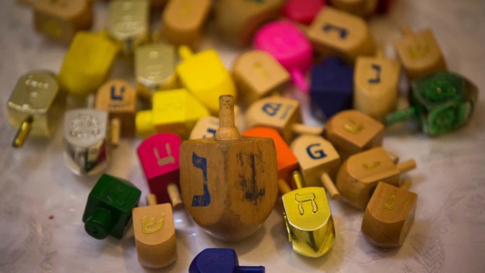 Dreidels (tops) for the Hanukkah holiday, Mea Shearim neighborhood of Jerusalem, Nov. 21, 2013. Photo by Yonatan Sindel/Flash90.