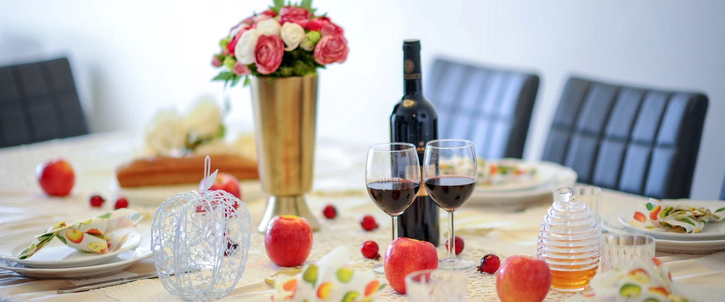 A dinner table set for the traditional Rosh Hashanah meal. Photo by Mendy Hachtman/Flash90.