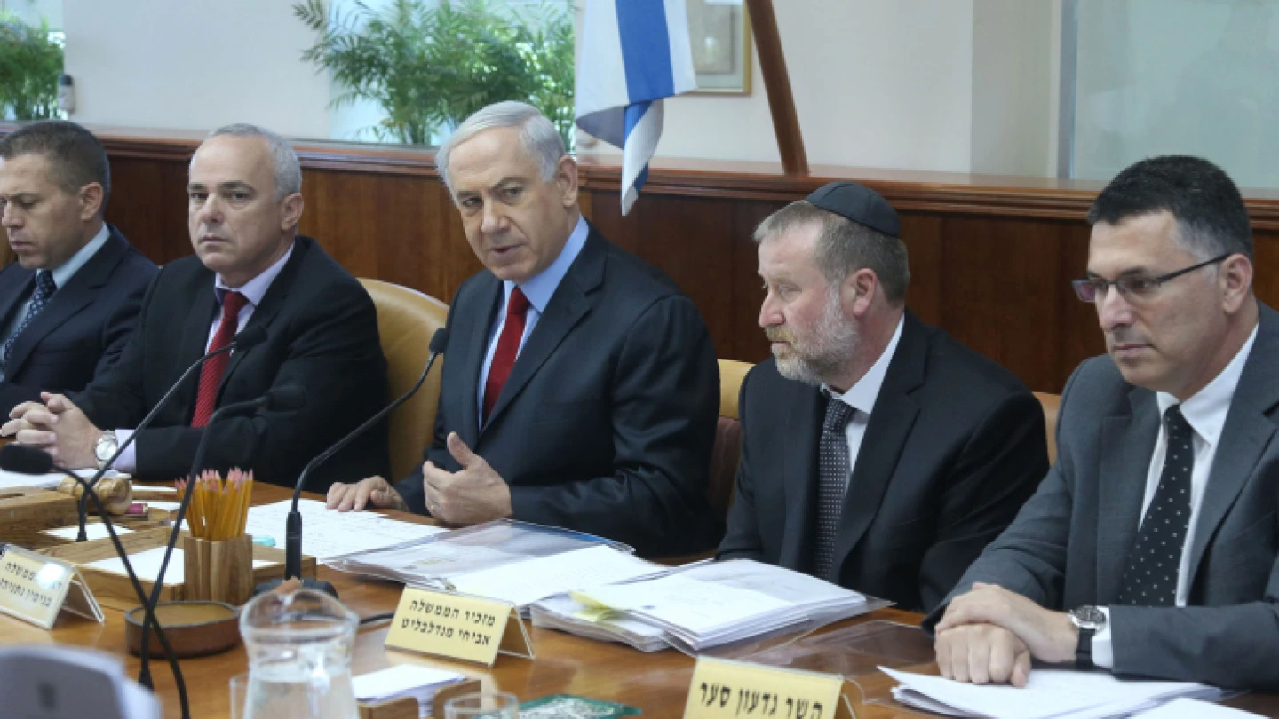 Israeli Prime Minister Benjamin Netanyahu leads the weekly Cabinet meeting, at his office in Jerusalem on June 8, 2014. To his right is then-Cabinet Secretary and current Attorney General Avichai Mandelblit; to his left is former Likud challenger and current New Hope Party leader Gideon Sa'ar. Photo by Marc Israel Sellem/POOL/Flash90.