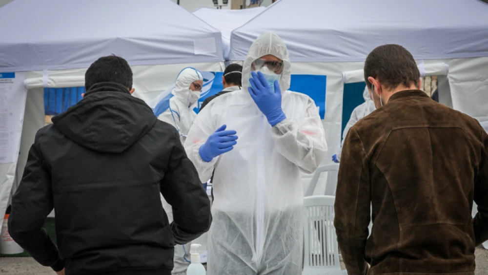Israelis show up to vote at a special polling station in Jerusalem for people under quarantine due to possible exposure to coronavirus, on March 2, 2020. Photo by Nati Shohat/Flash90.