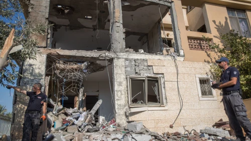 Israeli security forces at the scene where a building was hit by a rocket fired from the Gaza Strip in the southern Israeli city of Beersheva on Oct. 17, 2018. Photo by Yonatan Sindel/Flash90.