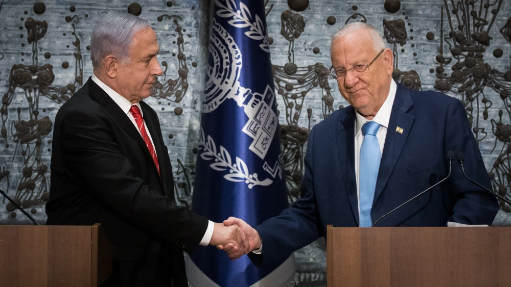 Israeli President Reuven Rivlin presents Israeli Prime Minister Benjamin Netanyahu with the mandate to form a new government following the Sept. 17 general elections that nearly repeated the April 9 results, at the President's Residence in Jerusalem, Sept. 25, 2019. Photo by Yonatan Sindel/Flash90.