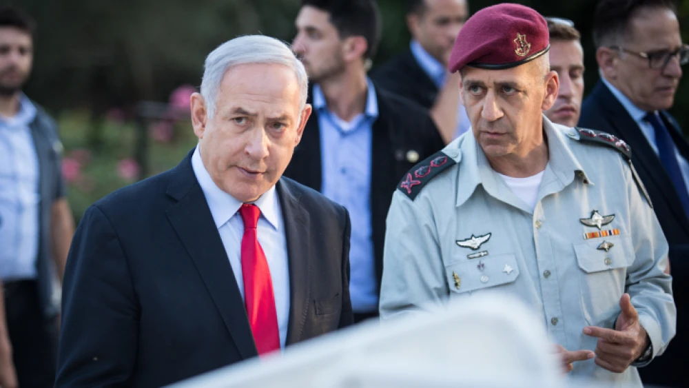 Israeli Prime Minister Benjamin Netanyahu (left) speaks with IDF Chief of Staff Lt. Gen. Aviv Kochavi during an event honoring outstanding IDF reservists, at the President's Residence in Jerusalem on July 1, 2019. Photo by Hadas Parush/Flash90.