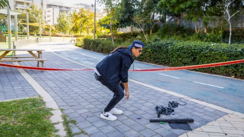 An Israeli policeman at the scene where a drone fired from Yemen hit a building in Yavne, Dec. 9, 2024. Photo by Liron Moldovan/Flash90.
