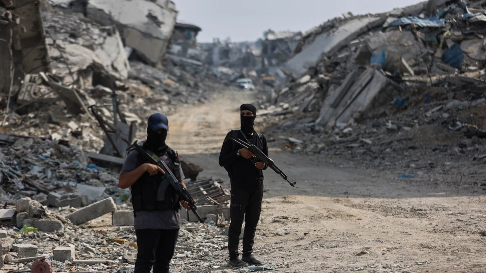 Armed Hamas terrorists stand guard in Gaza City, Nov. 3, 2025. Photo by Omar al-Qattaa/AFP via Getty Images.