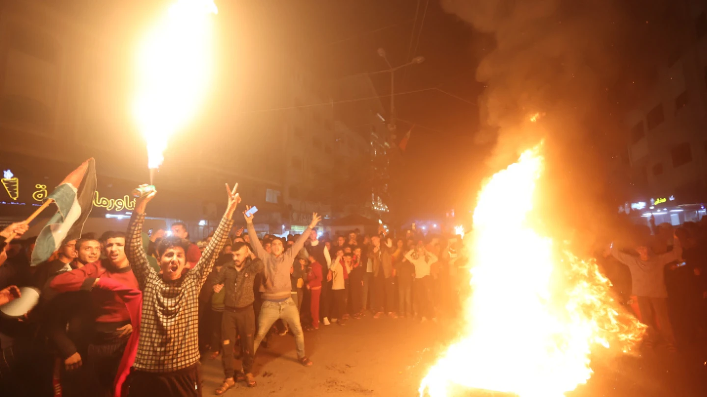 Palestinians celebrate in Gaza City following a terror attack in Jerusalem that left seven Israelis dead, on Jan. 27, 2023. Photo by Atia Mohammed/Flash90.