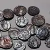 The rare hoard of 22 copper coins over 1,600 years old discovered in the Lower Galilee. Credit: Emil Aladjem, Israel Antiquities Authority.