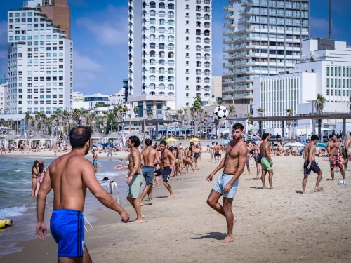People enjoy the beach in Tel Aviv, Oct. 5, 2024. Photo by Avshalom Sassoni/Flash90.
