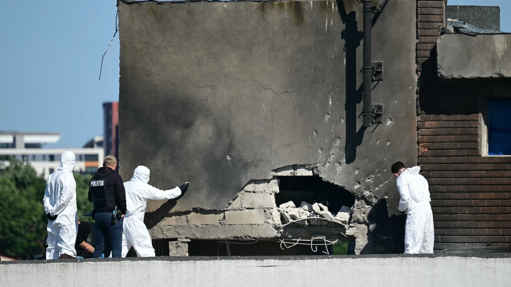 Police and forensic investigators examine the point of impact after a Russian drone struck an apartment building in Galati, eastern Romania, on May 29, 2026. Photo by Daniel Mihailescu/AFP via Getty Images.