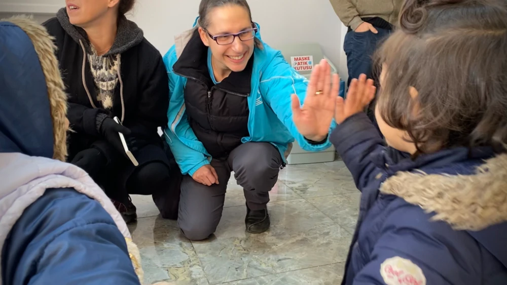 Leora Wine, director of disaster response for the American Jewish Joint Distribution Committee, with children in Turkey, February 2023. Photo courtesy of JDC.
