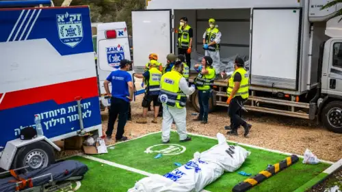 ZAKA emergency response personnel remove the corpses of civilians murdered by Hamas terrorists near Israel's border with Gaza, Oct. 9, 2023. Photo by Yossi Aloni/Flash90.