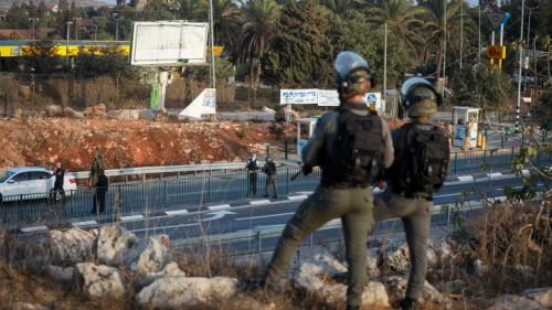 Israeli soldiers guard a bus station at the entrance to the Israeli community of Ofra, Oct. 4, 2022. Credit: Flash90.