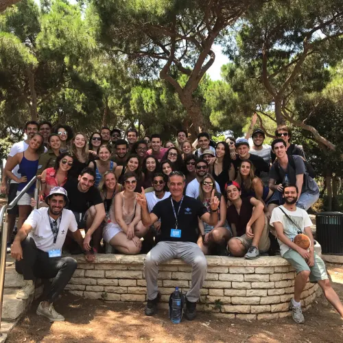 Birthright CEO Gidi Mark posing with trip participants in Israel. Credit: Courtesy.