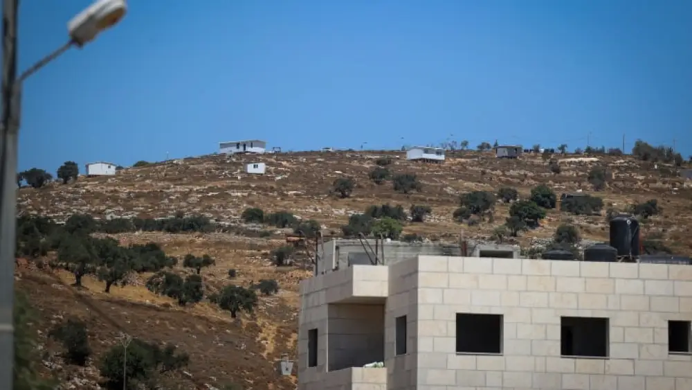 The Jewish community of Oz Zion is seen from Burqa during the funeral of Palestinian Kosai Ma'atan, Aug. 5, 2023. Credit: Flash90.