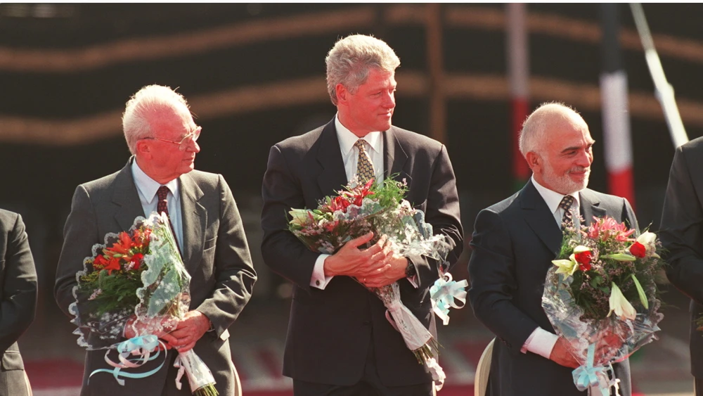 Israeli Prime Minister Yitzhak Rabin and King Hussein of Jordan sign a historic peace treaty during a ceremony at the Wadi Araba border crossing on Oct. 26, 1994. Photo by David Brauchli/Sygma via Getty Images.