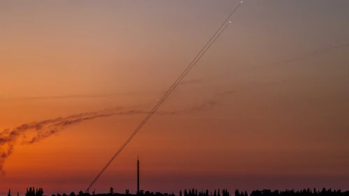 Terrorists fire a rocket from the Gaza Strip, as seen from Western Negev, Aug. 7, 2022. Photo by Yonatan Sindel/Flash90.