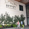 A guest displaced from the war with Hamas in the Gaza Strip walks outside Yad Sarah's “Yirmiyahu 33” Rehabilitation and Wellness Hotel in Jerusalem, October 2023. Credit: Courtesy.