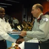 Click photo to download. Caption: Moshe Ya'alon, now Israel's vice prime minister and former IDF chief of staff, presents an award of excellence to an Israeli naval officer. Credit: IDF Spokesperon.