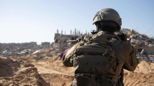 IDF soldier seen in an unknown location in the Gaza Strip, in front of rubble and ruin. Credit: IDF.