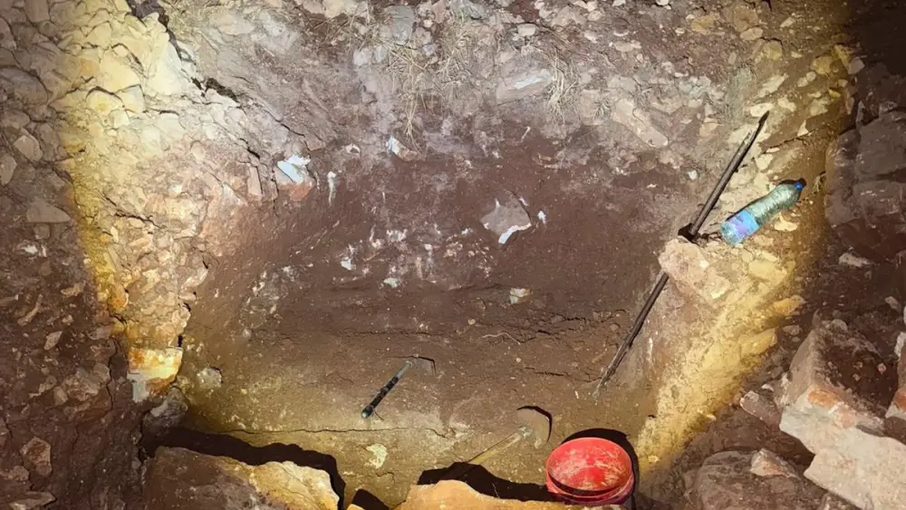 Digging tools and buckets sit inside a shaft excavated near the Jerusalem security barrier that authorities say was part of an infiltration tunnel plot. Credit: Israel Police.