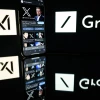 This photograph taken on Jan. 13, 2025, in Toulouse, France, shows screens displaying the logo of Grok, a generative artificial-intelligence chatbot developed by xAI, the U.S. company specializing in artificial intelligence created by Elon Musk. Photo by Lionel Bonaventure/AFP via Getty Images.