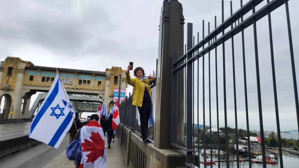 Masha Kleiner (right) along with other marchers on the Burrard Bridge on April 6, 2025. Photo by Erez Linn.