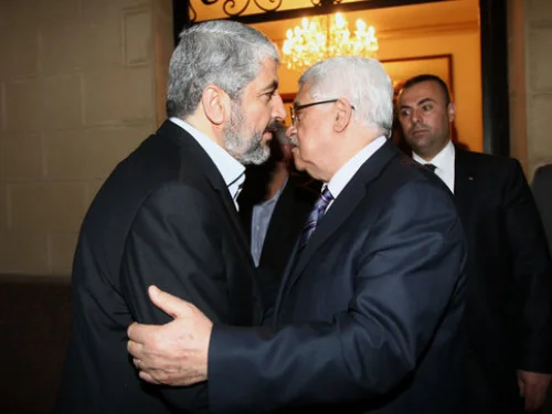 Hamas leader Khaled Mashaal (left) meets with Palestinian Authority head Mahmoud Abbas in Cairo, Feb. 23, 2012. Photo by Mohammed al-Hums/Flash90.