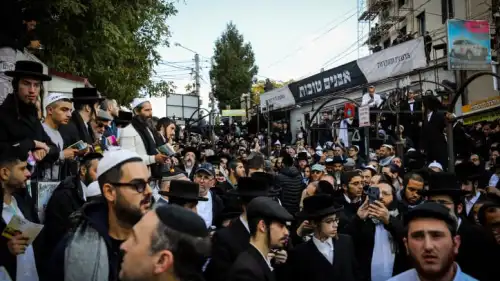 Jewish men in the street near the tomb of Rabbi Nachman of Breslov in Uman on eve of Rosh Hashanah, Sept. 25, 2022. Credit: Flash90.