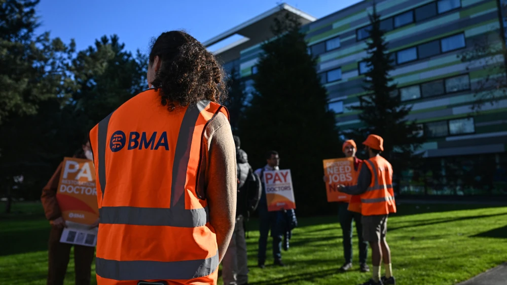 A member of the British Medical Association (BMA) joins staff during a strike outside the Manchester University NHS Foundation Trust in Manchester, England, on April 7, 2026. Photo by Paul Ellis/AFP via Getty Images.