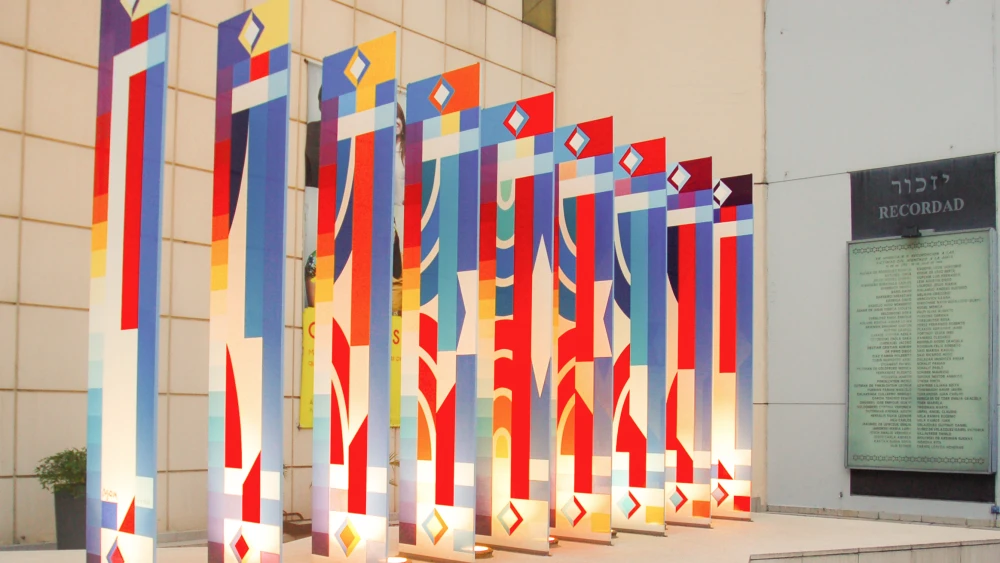 The Agam Monument, a sculpture honoring the victims of the 1994 terrorist attack on the Asociación Mutual Israelita Argentina building, outside the rebuilt center in Buenos Aires, Argentina. Credit: Mprofeta via Wikimedia Commons.