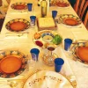 A Passover seder table. Susan Abeles received a five-day suspension for going AWOL from work during Passover, and was later forced into early retirement. Credit: Gilabrand via Wikimedia Commons.